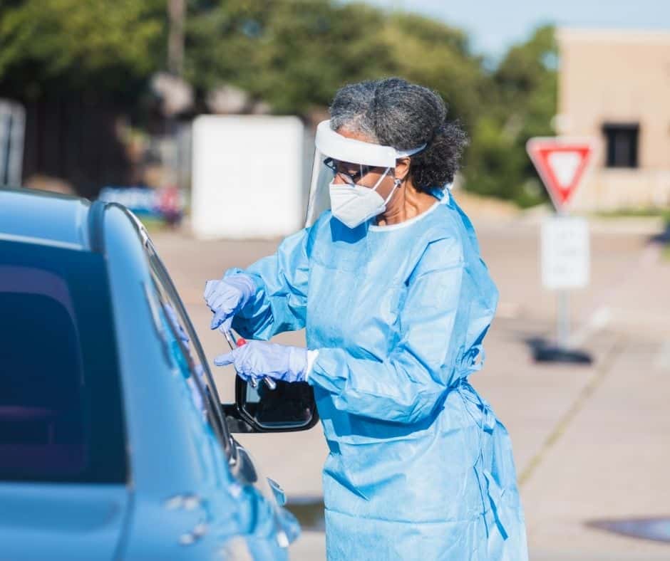 Nurse at drive thru healthcare station during COVID19